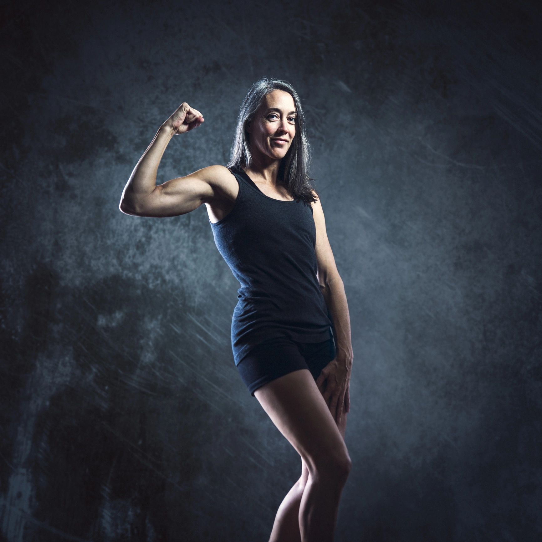 Portrait of a fit mature athlete smiling