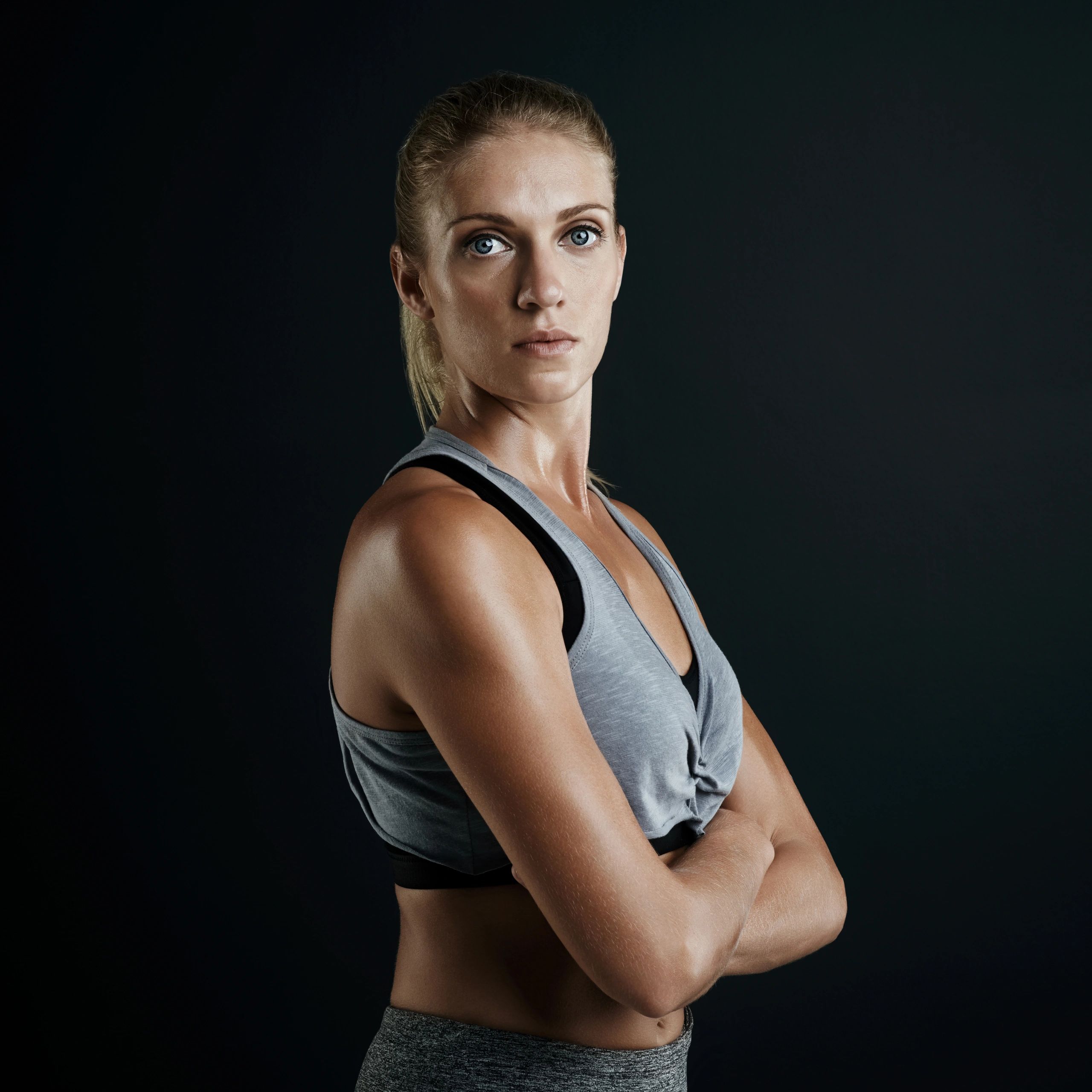 Portrait of a confident woman against a dark background
